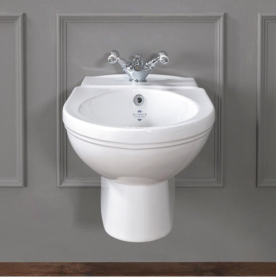 Bidet with taps on wall